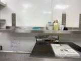 a metal counter with a bunch of items on it