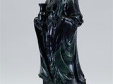 statue of a woman holding a vase on a pedestal