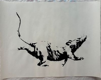 a black and white drawing of a rat on a piece of paper