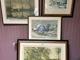 three framed pictures on the wall of a room