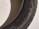 a close up of a tire on a white surface