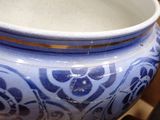 a blue and white vase sitting on a table