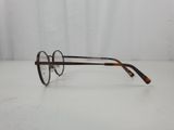 a pair of glasses sitting on top of a white table