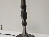 a lamp that is sitting on a table with a cord