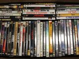 a lot of dvds in a box on the table