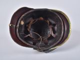 a brown leather hat with a flower on the top of it