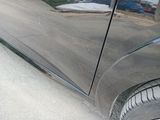 a reflection of a car on the side of the road