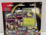 a close up of a box of pokemon cards on a white surface
