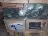 many bags of vegetables on a pallet in a warehouse