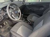 the interior of a car with the door open showing the steering wheel and dashboard