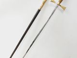 two swords with a wooden handle on a white surface