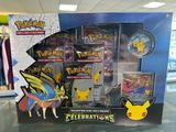 display case of pokemon trading card game with pikachu figure