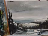 a painting of a mountain scene on a easel