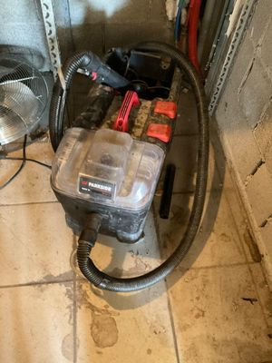 a blower and a fan on the floor in a room