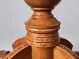 an image of a wooden table with a round top and a wooden base