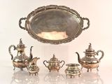 a lot of silver items that are sitting on a table