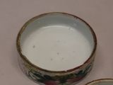 a small bowl and a small bowl sitting on a table