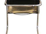 a black leather and chrome chair on a white background