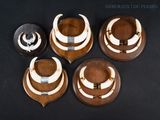 several pieces of wood with horns on them on a black surface