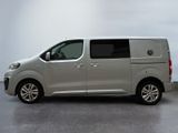 the silver van is parked on the concrete floor in the room
