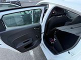 a white car with its door open in a parking lot