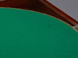 an image of a close up of a table with a green cloth on it