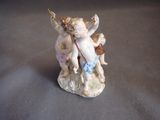 a figurine of a cupid with a bow on it