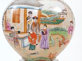 a vase with a painting of people on it