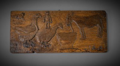 une image représentant une plaque en bois sur laquelle figurent un cheval et son cavalier
