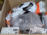 a cardboard box filled with assorted items on a table