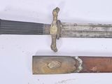two different types of knives on a white surface