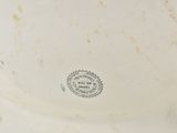 a white bowl with a black and white design on it