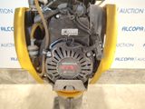 the engine of a small engine is sitting on a stand