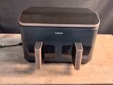 an image of a printer sitting on top of a wooden table