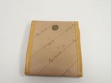 a close up of a wallet with writing on it on a white surface