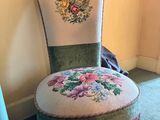 a chair with a floral design on the back of it