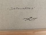 a close up of a piece of art with writing on it