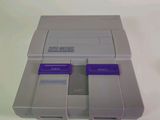 a video game console sitting on top of a white table