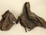 pair of old leather baseball mitts and a baseball glove