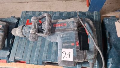 a corded drill and a corded hammer on a pallet