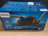 the box of the philips vacuum cleaner is open on the table
