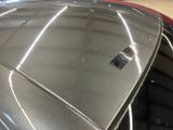 a car with a sticker on the hood of it