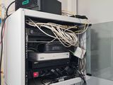 a white cabinet with a bunch of wires on top of it