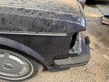 a car that has been damaged and is sitting on the ground