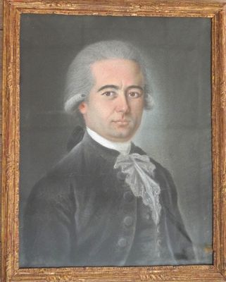 portrait of a man in a black coat with a white bow tie
