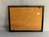 an old picture frame with a cork board attached to it