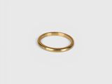 a gold ring on a white background