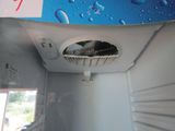 a picture of the inside of a refrigerator with water droplets on it