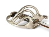 a close up of a metal object on a white background