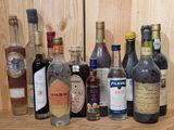 many different types of alcohol bottles lined up on a shelf